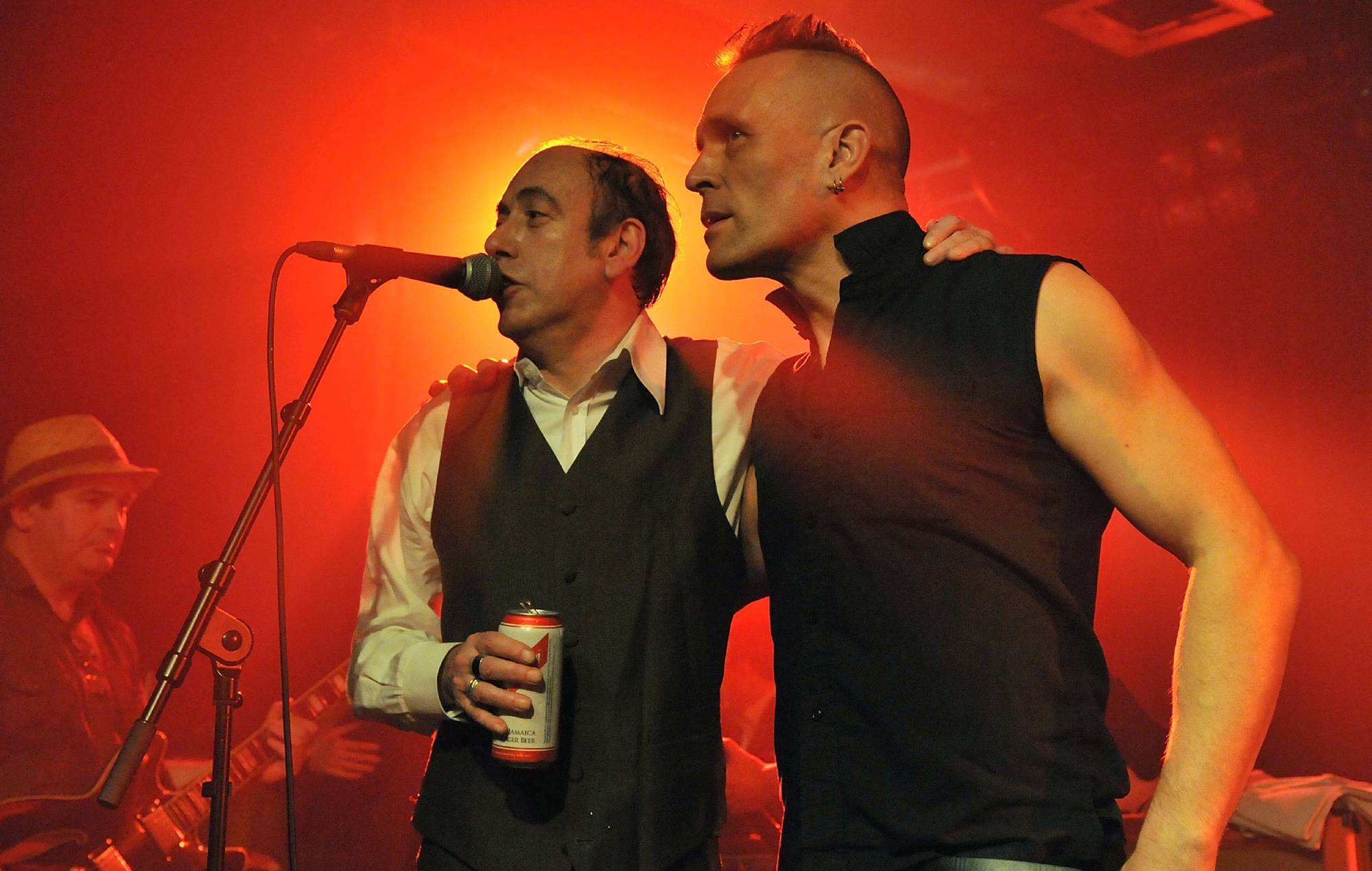 Mick Jones and John Robb speak on stage during the benefit event 'Justice Tonight' in aid of the Hillsborough Justice Campaign at the Scala in Kings Cross on December 8, 2011 in London, United Kingdom. (Photo by Jim Dyson/Getty Images)