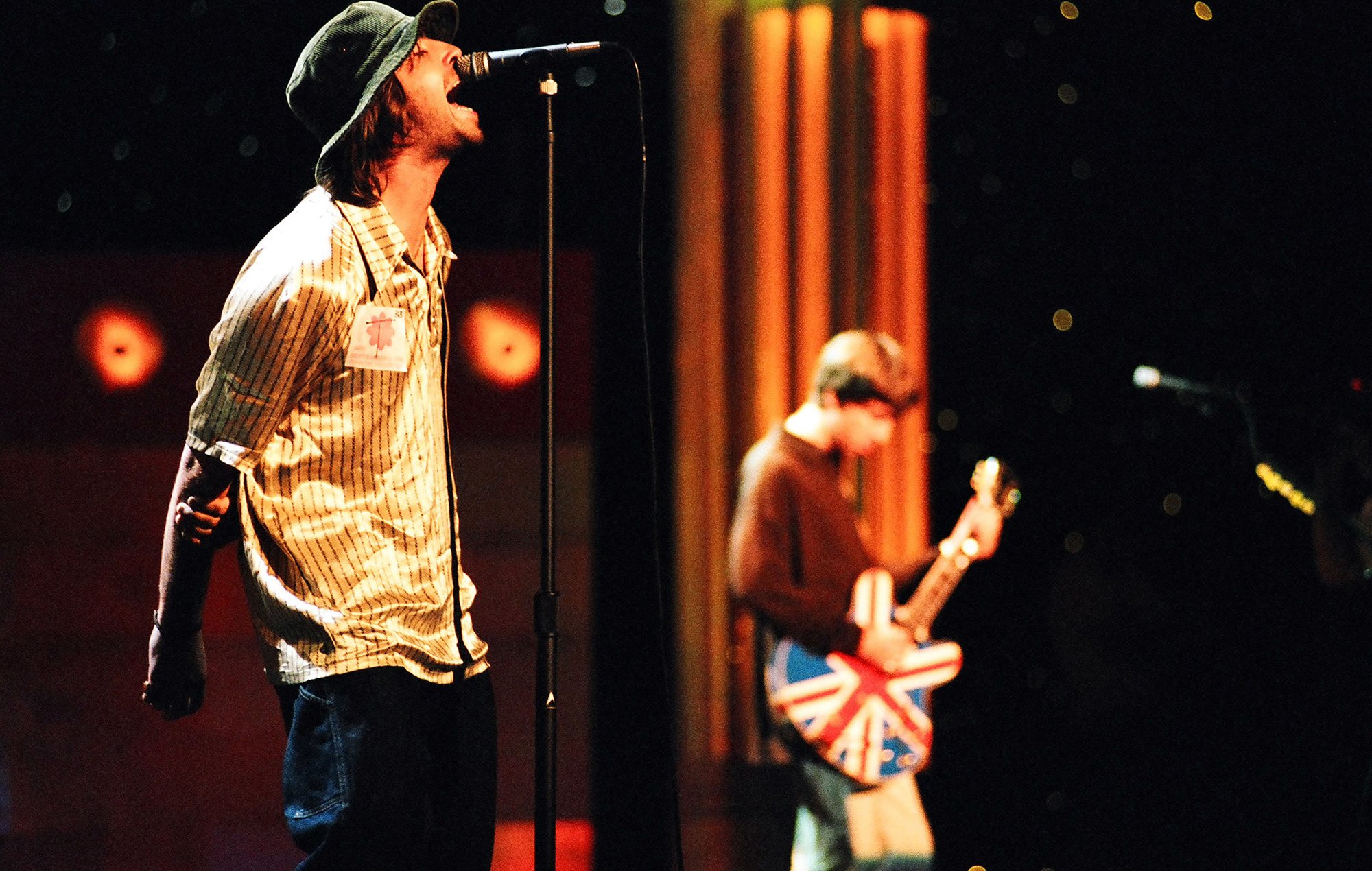 Liam Gallagher and Noel Gallagher of Oasis at the MTV VMA rehearsals in 1996, photo by Jeff Kravitz/FilmMagic via Getty Images