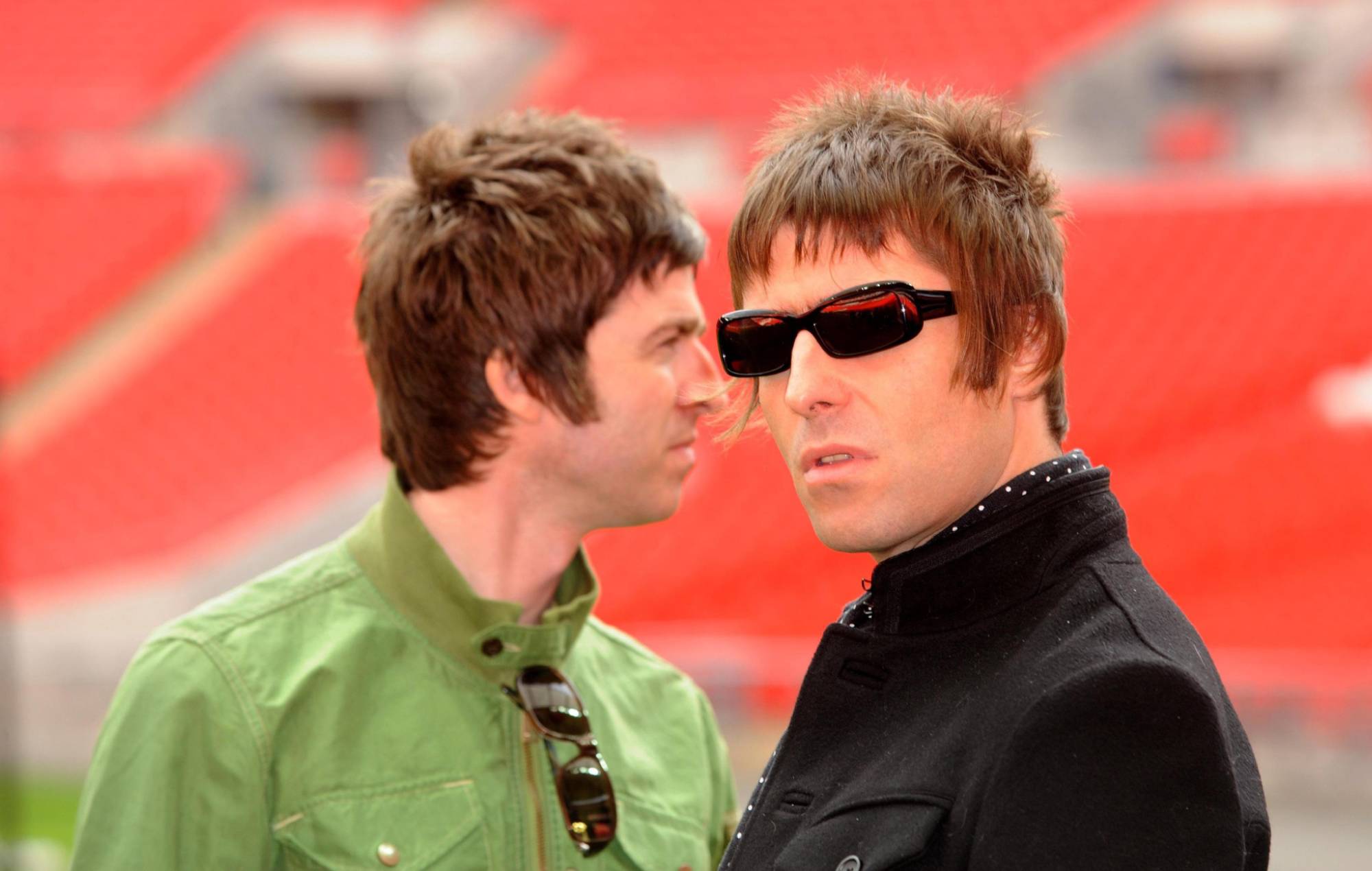 Noel Gallagher and Liam Gallagher are pictured during a photocall at Wembley Stadium. (Photo by Zak Hussein - PA Images/PA Images via Getty Images)