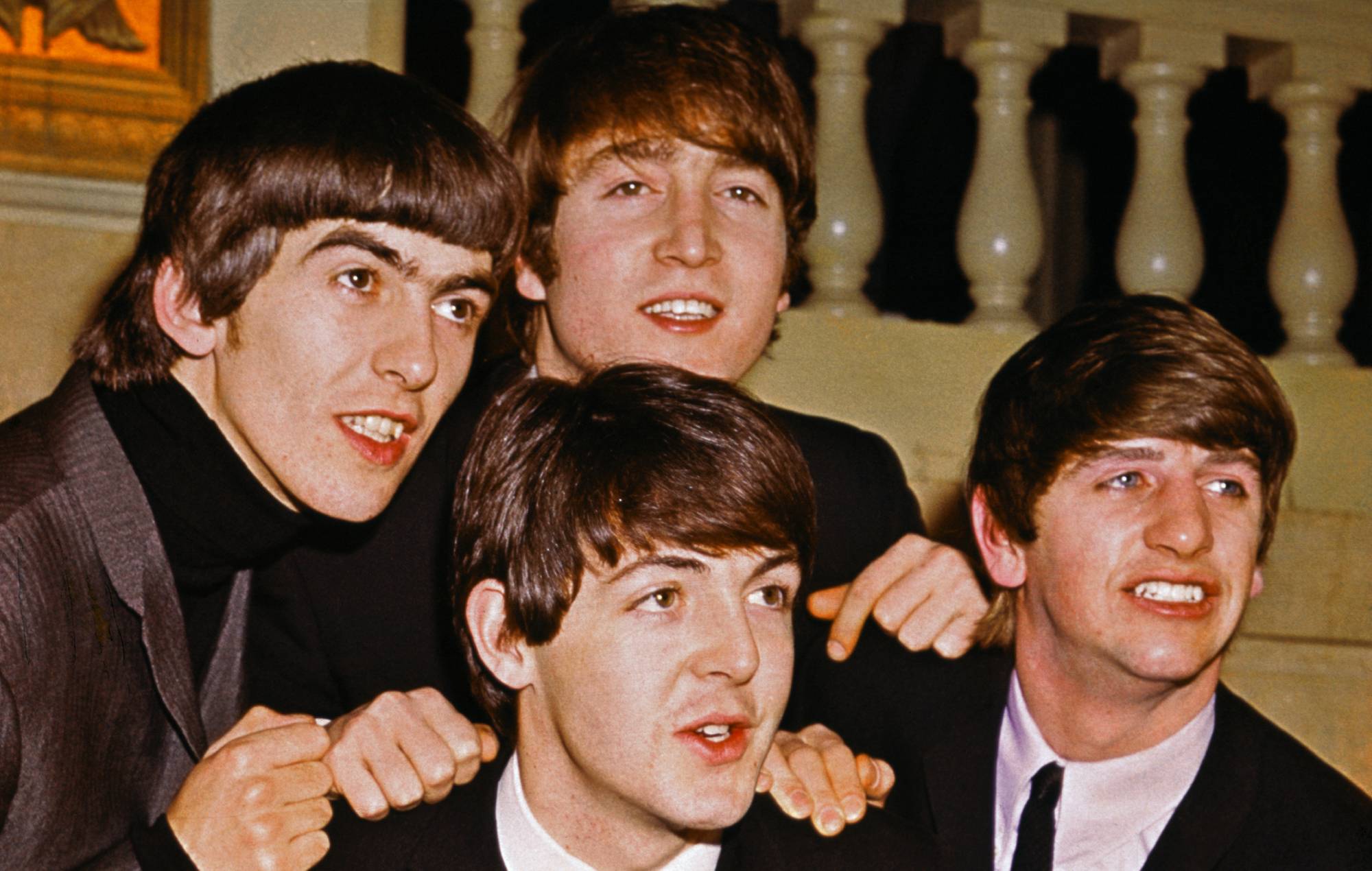 George Harrison, John Lennon (top), Paul McCartney (bottom), and Ringo Starr. (Photo by George Rinhart/Corbis via Getty Images)