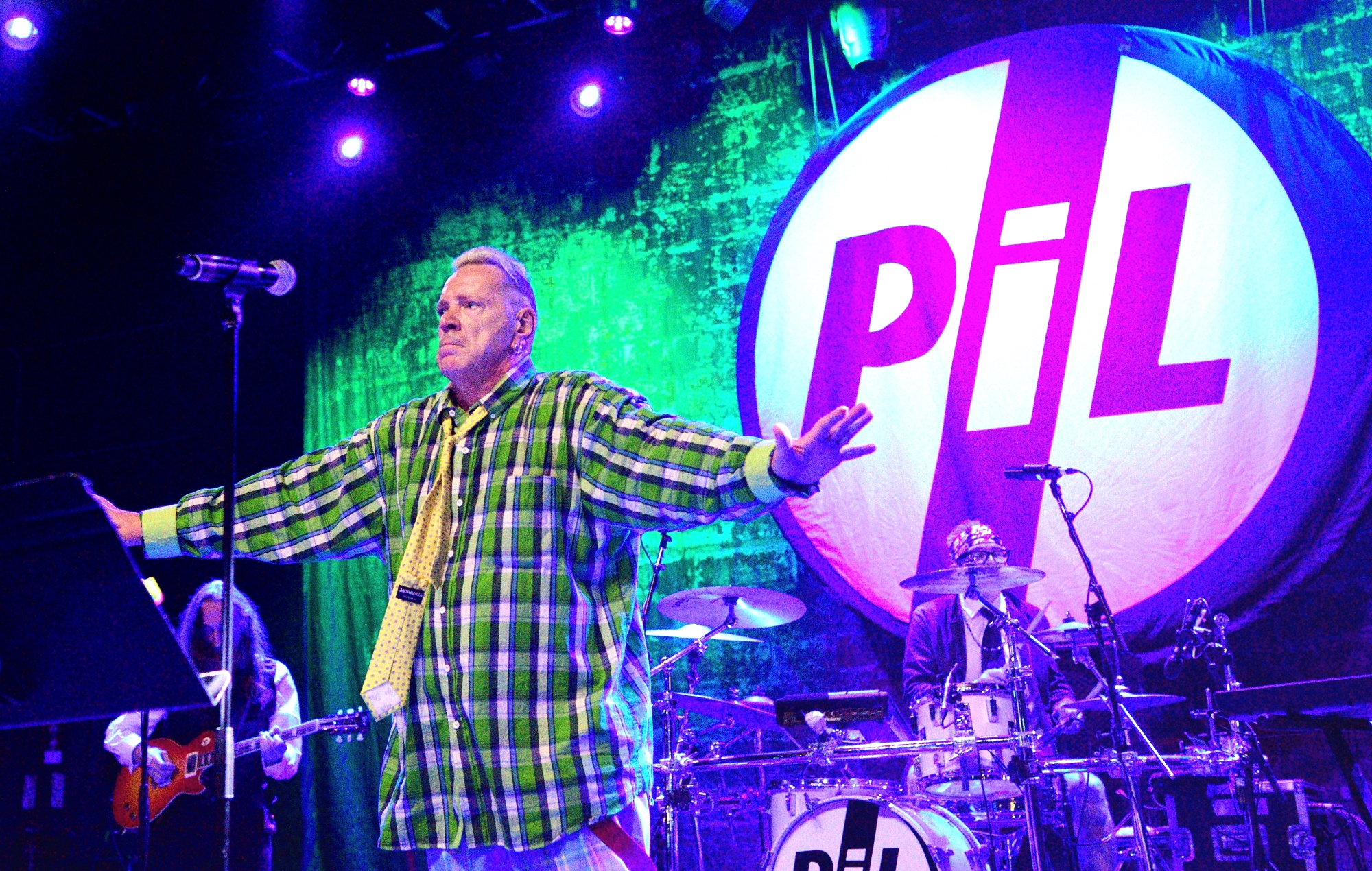 John Lydon performing live on stage with Public Image Ltd